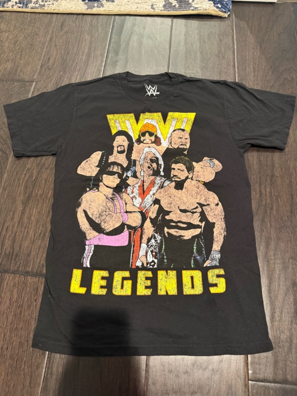 WWE Black Tee with Yellow NWOT LEGENDS Graphic